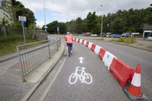 Temporary cycle lanes on Milburn Road improve active travel links to Raigmore Hospital from Inverness city centre.