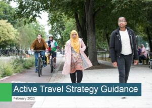 People walking and cycling along path with text banner Active Travel Strategy Guidance, February 2023