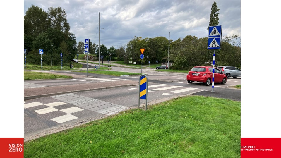 traffic calming measures on road in lead up to zebra crossing before a busy junction - narrow road lanes textured surface, and road markings. 