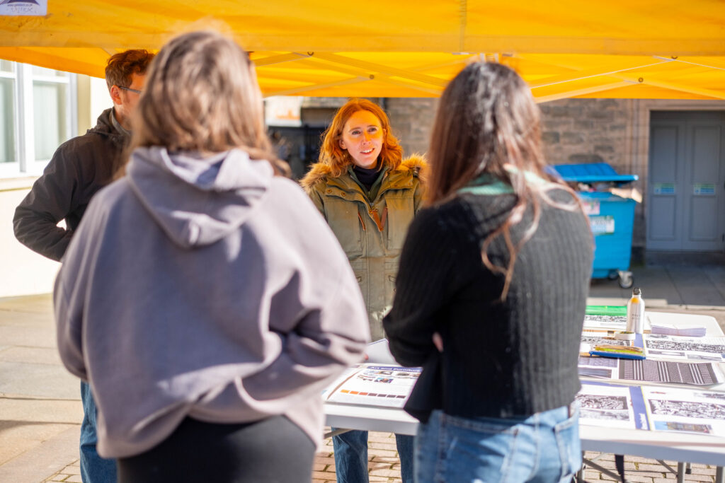 A Sustrans colleague discusses the Wick Lanes Pocket Places designs with residents at an event to mark completion of the project. Credit: Sustrans