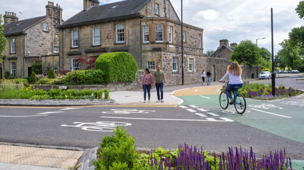 People walking and cycling on segregated infrastructure on Albert Place in Stirling